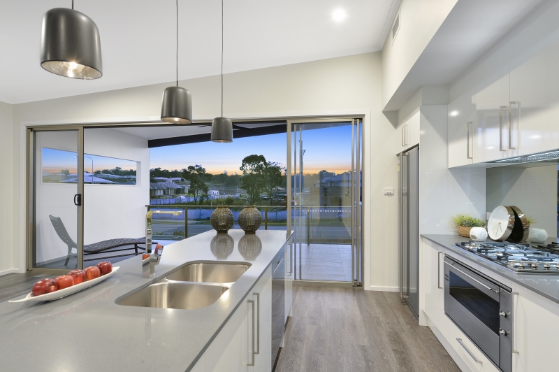 Home Design Internal/External. View from Kitchen across Alfresco and onto outdoor views. 2 storey duplex.