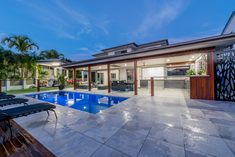 Home Design External. Night. Across pool to Alfresco.