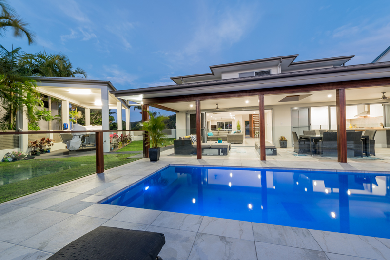 Home Design External. Night. Across pool to Alfresco.