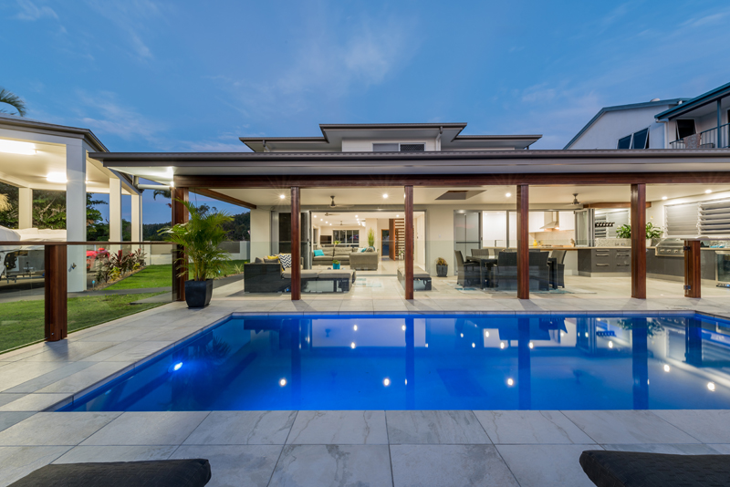 Home Design External. Night. Across pool to Alfresco.