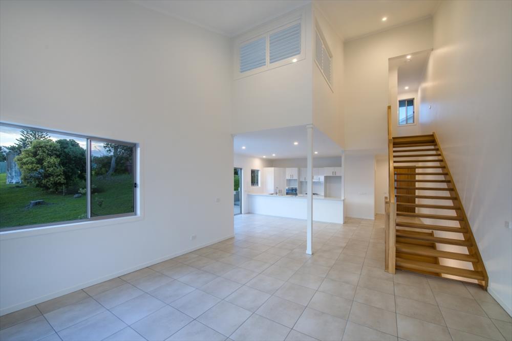 Home Design Internal. Lounge, Kitchen and looking up to internal stairs to top level.