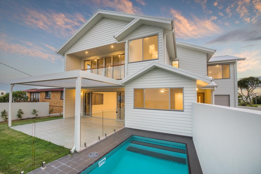 Home Design External. Pool. Unit 1 with garage of Unit 2 in distance.