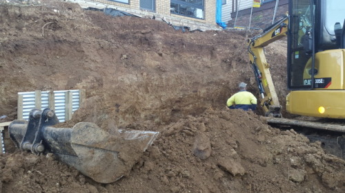 Extensive excavation underway this week on a steep and sloping