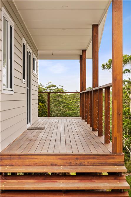 Hardwood timber open riser stairs, hardwood timber decking and stainless-steel wire balustrade and hardwood timber flat top rail