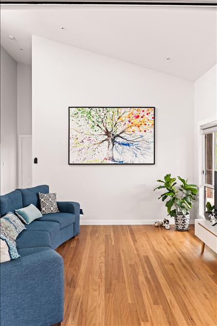 Living room with polished hardwood timber flooring and furnishings