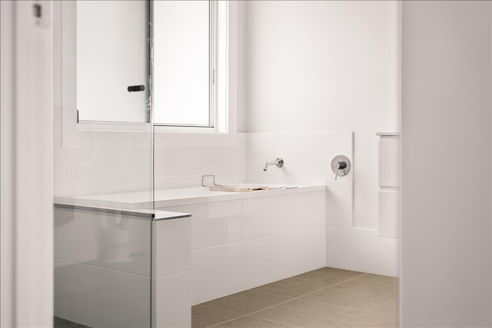 Close-up of Bathroom with Regency shower screen and Reece PC fixtures