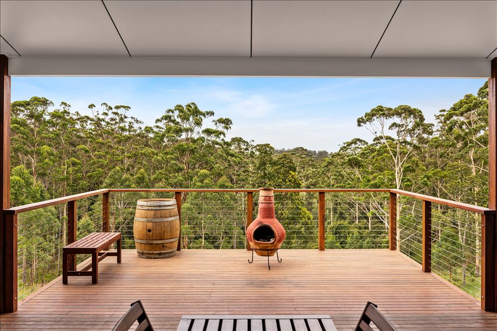 hardwood timber deck with freestanding fire pit and views over the trees